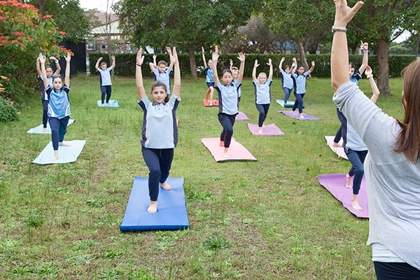 Students at St Michael's Catholic Primary School being taught yoga