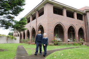 Two St Michael's Catholic Primary School Daceyville walking in the courtyard of Our Lady of The Sacred Heart convent